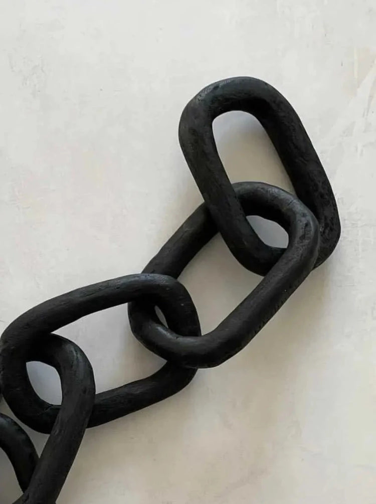 carved wood links in black