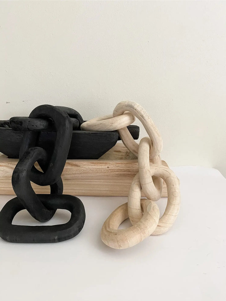 carved wood links in black