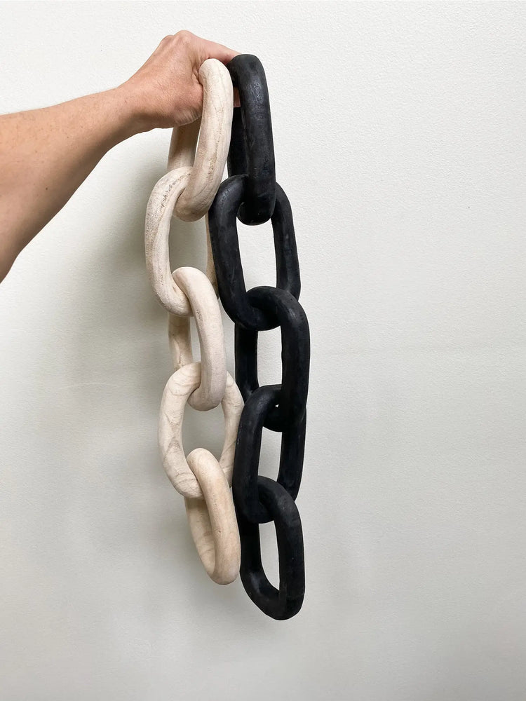 carved wood links in black